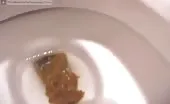 Cute blonde shitting