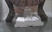 Hot wife shitting in a glass jar