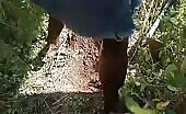 Black girl shitting in a forest