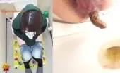 Shaved babe shitting in a public bathroom