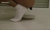 Petite girl shitting a lot on a plate