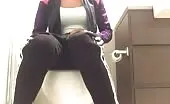 Busty babe shits over toilet