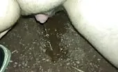 Fingering her pussy while pooping