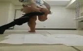 Shaved dark haired babe shitting