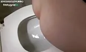 Curvy babe shits big ones over toilet