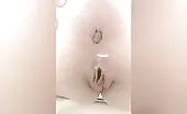 Shaved babe shitting