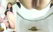 Dark haired beauty pooping
