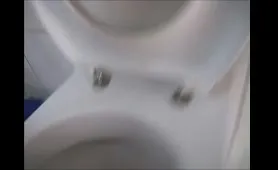 Nude Man Stroking His Cock While Pissing Into Toilet