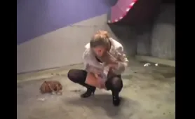 Blonde Squats and Pisses on Concrete Floor in Parking Garage