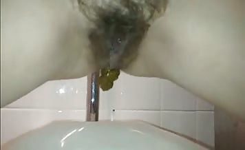 Hairy German shitting in toilet