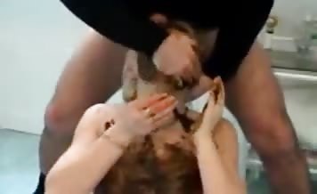 Smearing shit on her entire face