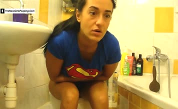 Wearing a superman T-shirt and pooping