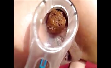 Milf in lingerie shits with speculum in ass